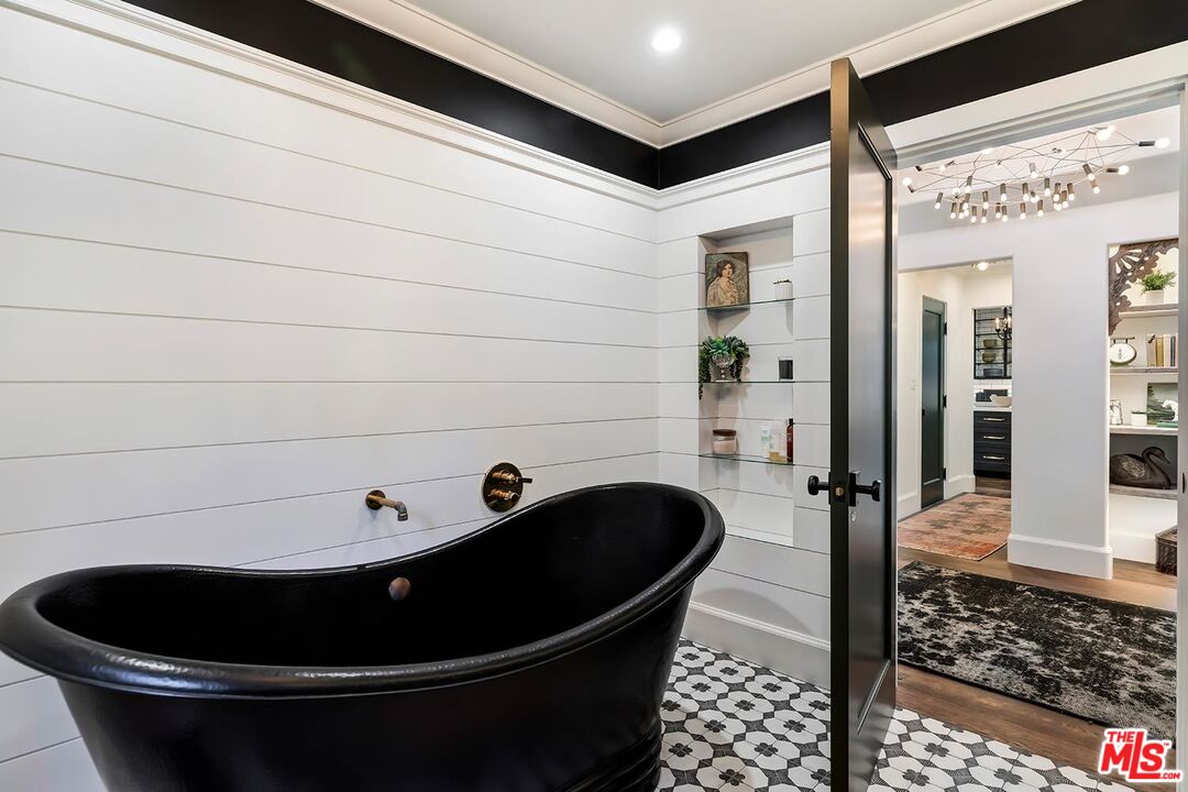 4416 Arcola Avenue Toluca Lake, CA 91602 - Photo 28 of 46 a room with a sink and glass door