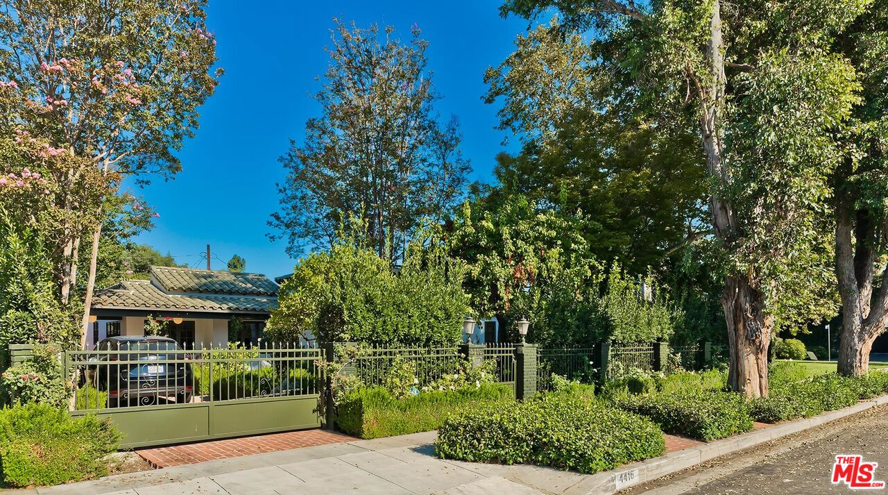4416 Arcola Avenue Toluca Lake, CA 91602 - Photo 3 of 46 a front view of a house with a garden