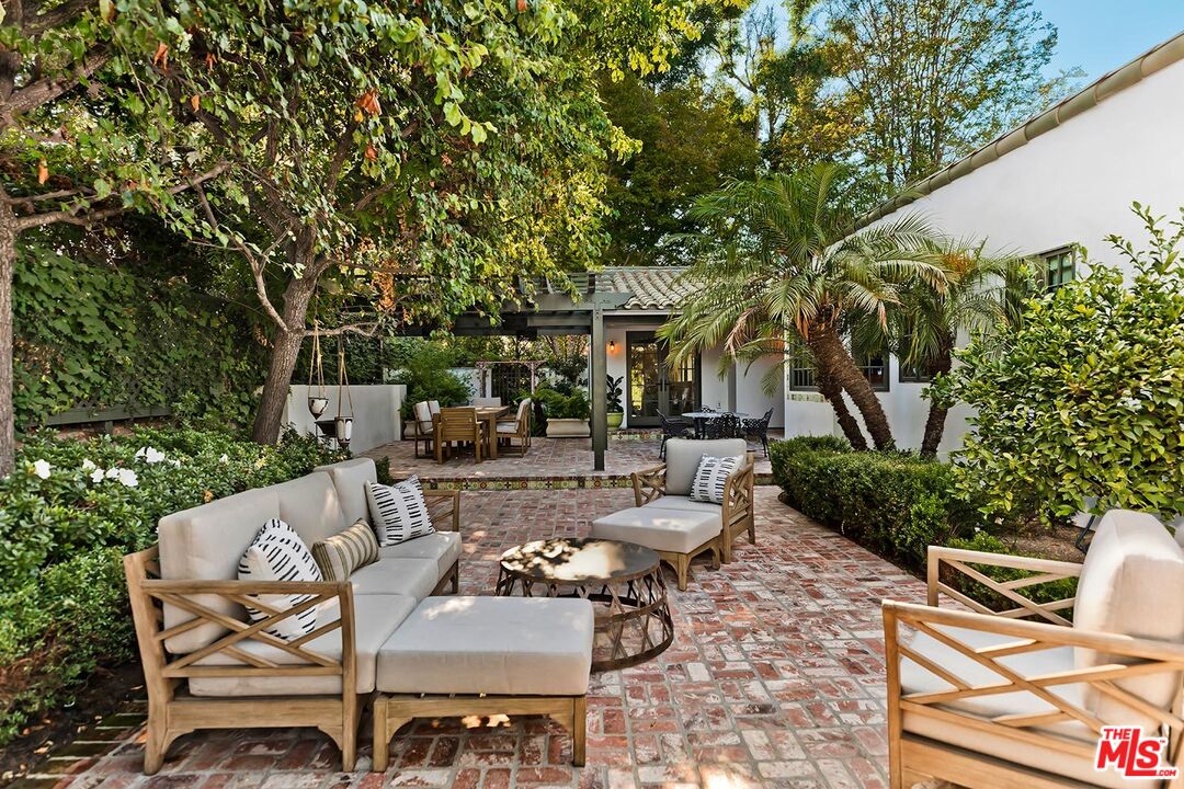 4416 Arcola Avenue Toluca Lake, CA 91602 - Photo 32 of 46 a view of a patio with table and chairs and potted plants