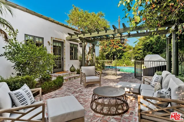 a view of a patio with a table and chairs
