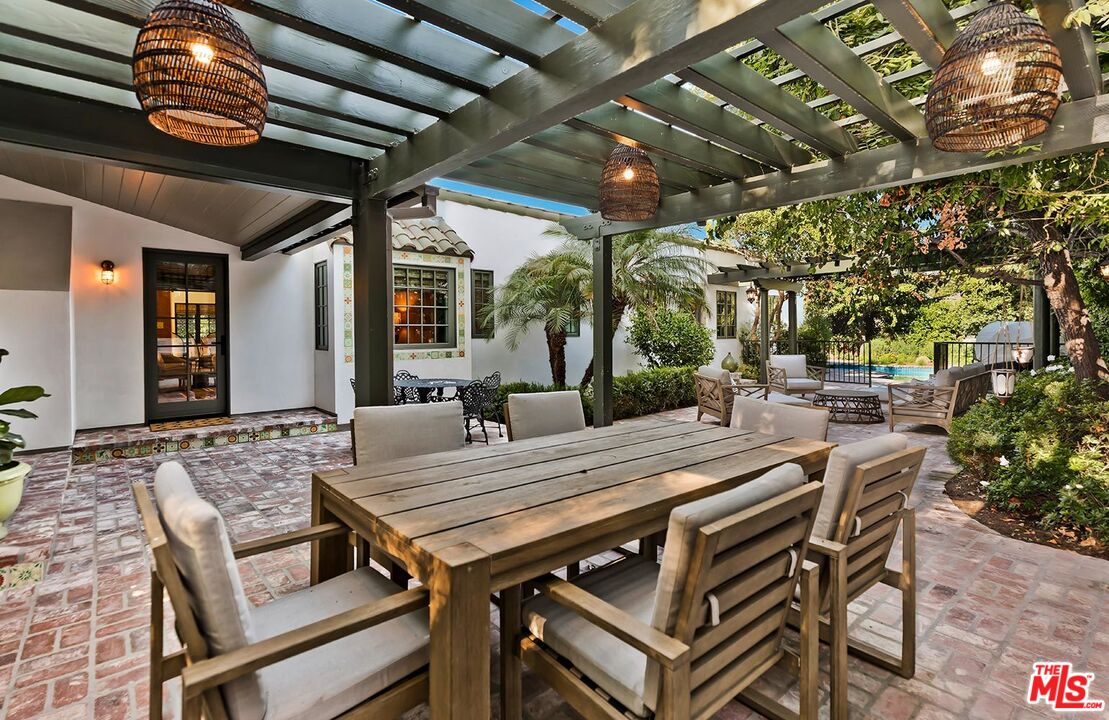 4416 Arcola Avenue Toluca Lake, CA 91602 - Photo 36 of 46 a view of a table and chairs in patio