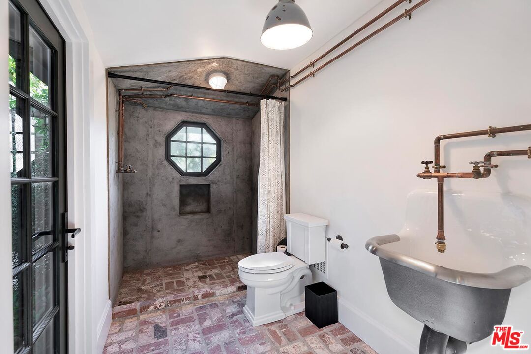 4416 Arcola Avenue Toluca Lake, CA 91602 - Photo 46 of 46 a bathroom with a toilet and a shower