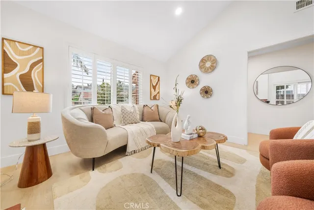 a kitchen with granite countertop a refrigerator and a sink