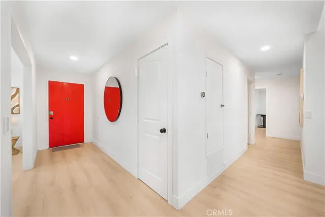 a spacious bathroom with a double vanity sink a mirror and a shower
