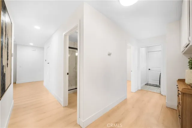 a bathroom with a granite countertop sink a mirror and a shower
