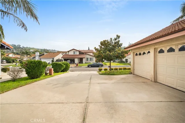 a living room with furniture and a large window with outer view