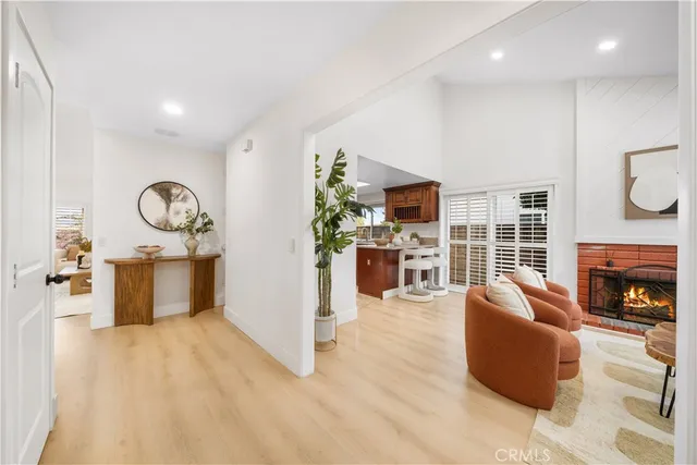 a living room with furniture and kitchen view