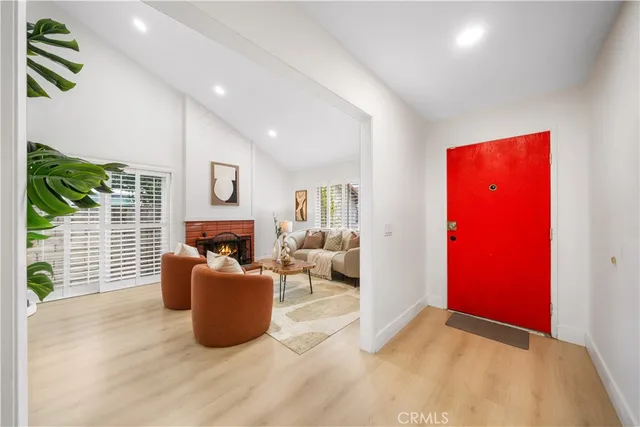 a living room with furniture fireplace and flat screen tv