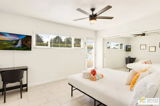 a living room with furniture and flat screen tv