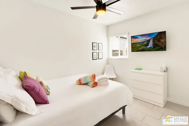 a bedroom with a bed and a dresser