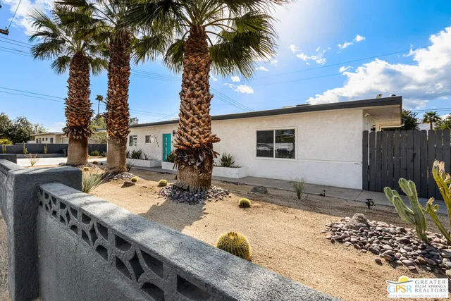 a backyard of a house with seating space