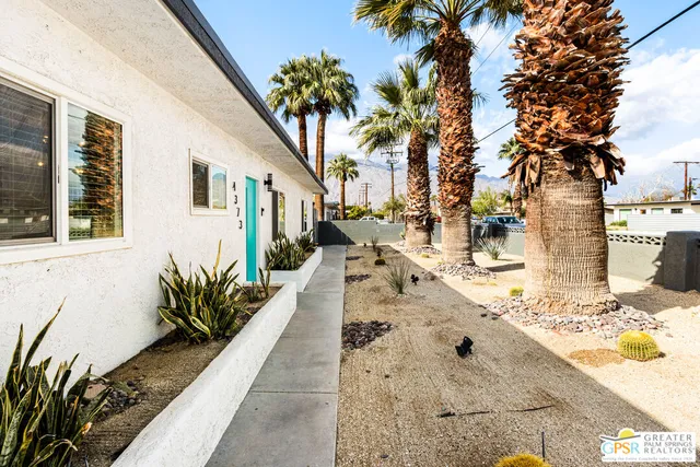 a view of a backyard of the house