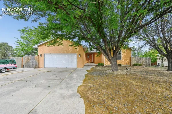 a house with trees in front of it