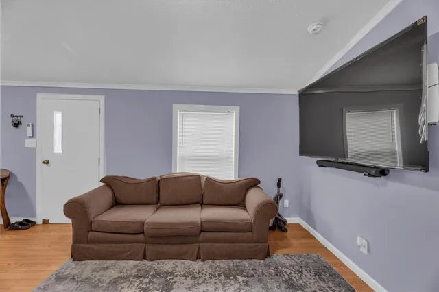 a living room with a couch and a flat screen tv