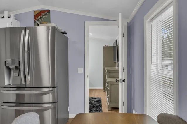 a kitchen with stainless steel appliances granite countertop a refrigerator and a refrigerator
