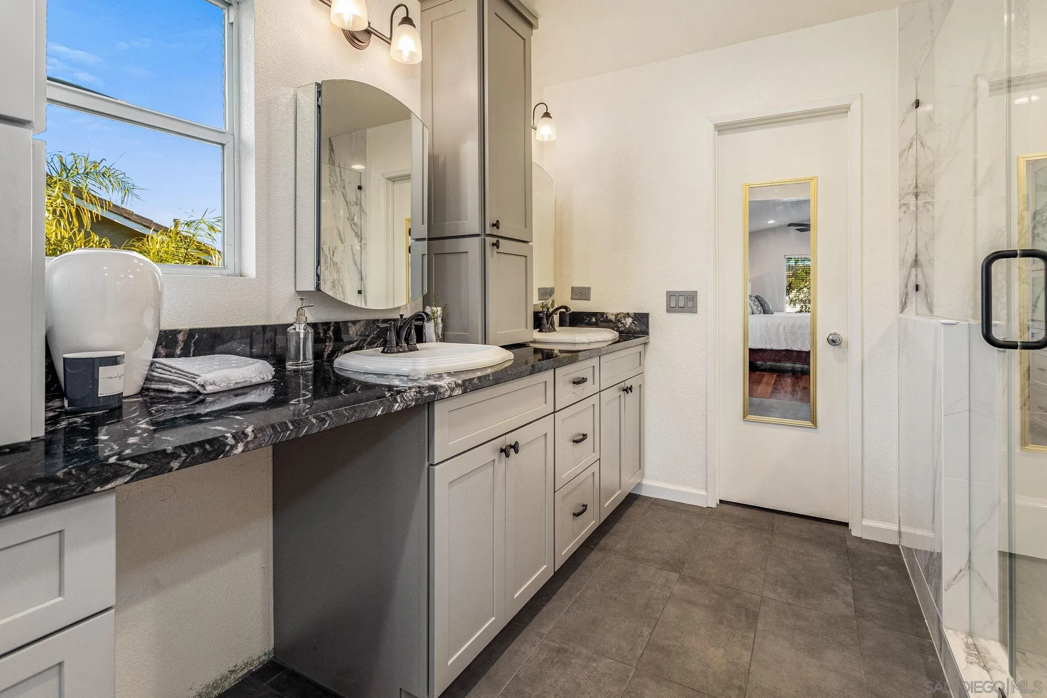 5462 Senegal Street Oceanside, CA 92057 - Photo 19 of 47 a kitchen with a sink stove and cabinets