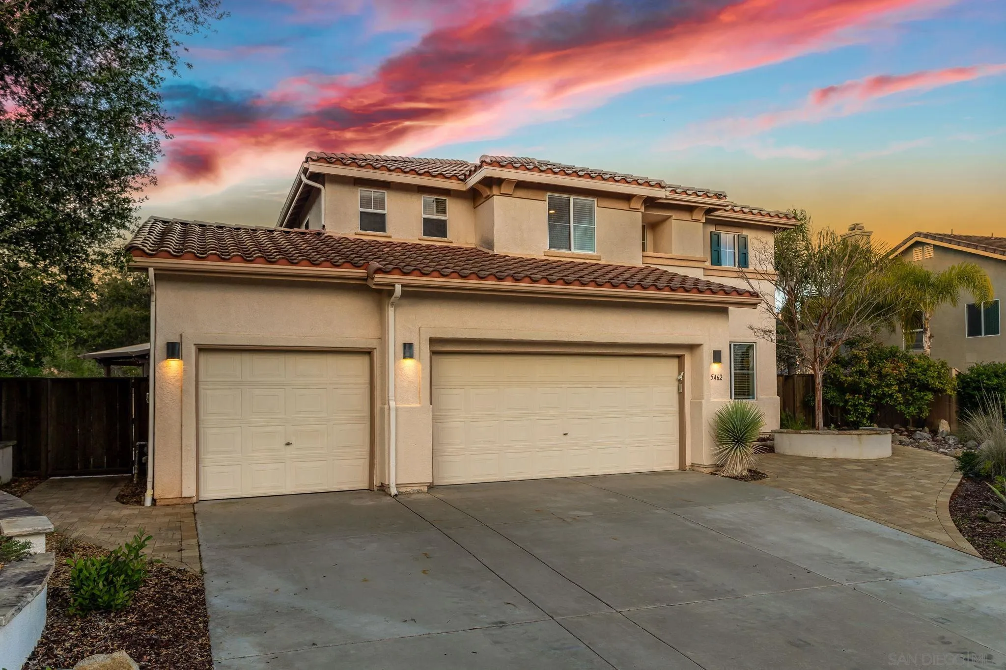 5462 Senegal Street Oceanside, CA 92057 - Photo 2 of 47 a front view of a house with a yard and garage