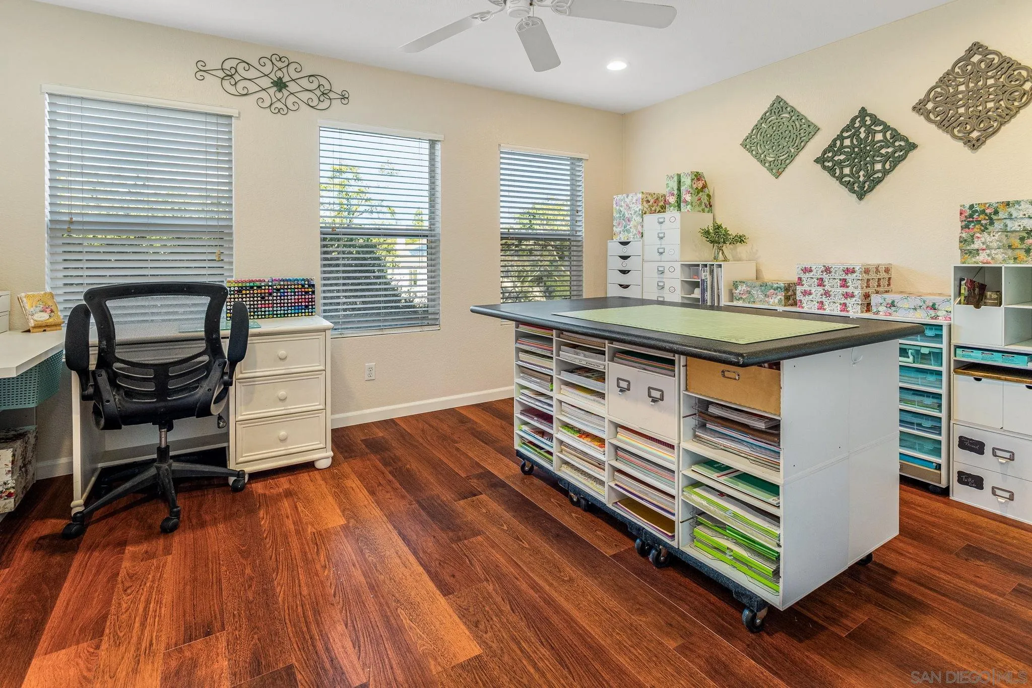5462 Senegal Street Oceanside, CA 92057 - Photo 21 of 47 a kitchen with a sink and wooden floor