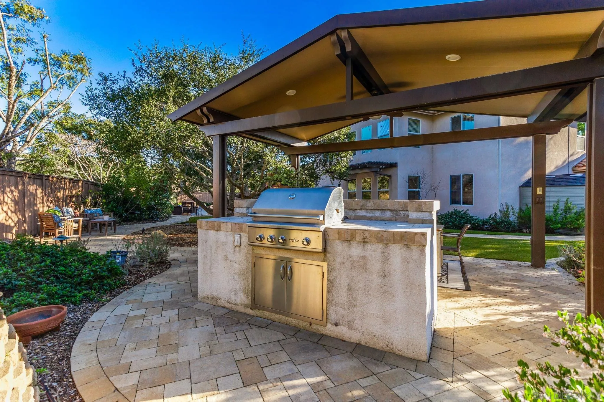 5462 Senegal Street Oceanside, CA 92057 - Photo 28 of 47 a patio with table and chairs