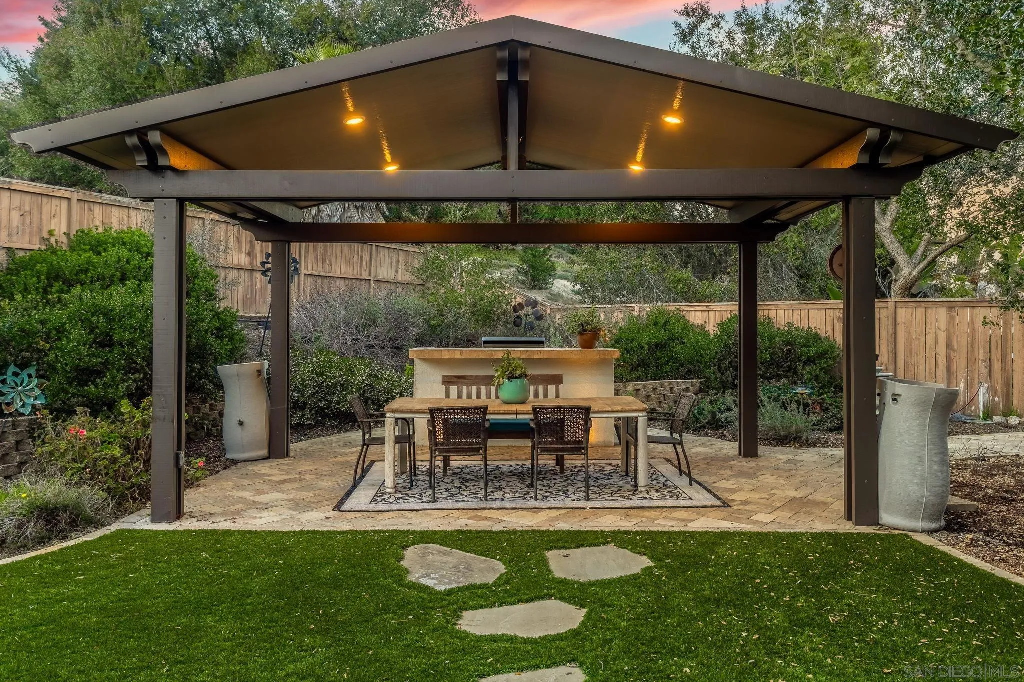 5462 Senegal Street Oceanside, CA 92057 - Photo 31 of 47 a patio with glass top table and chairs