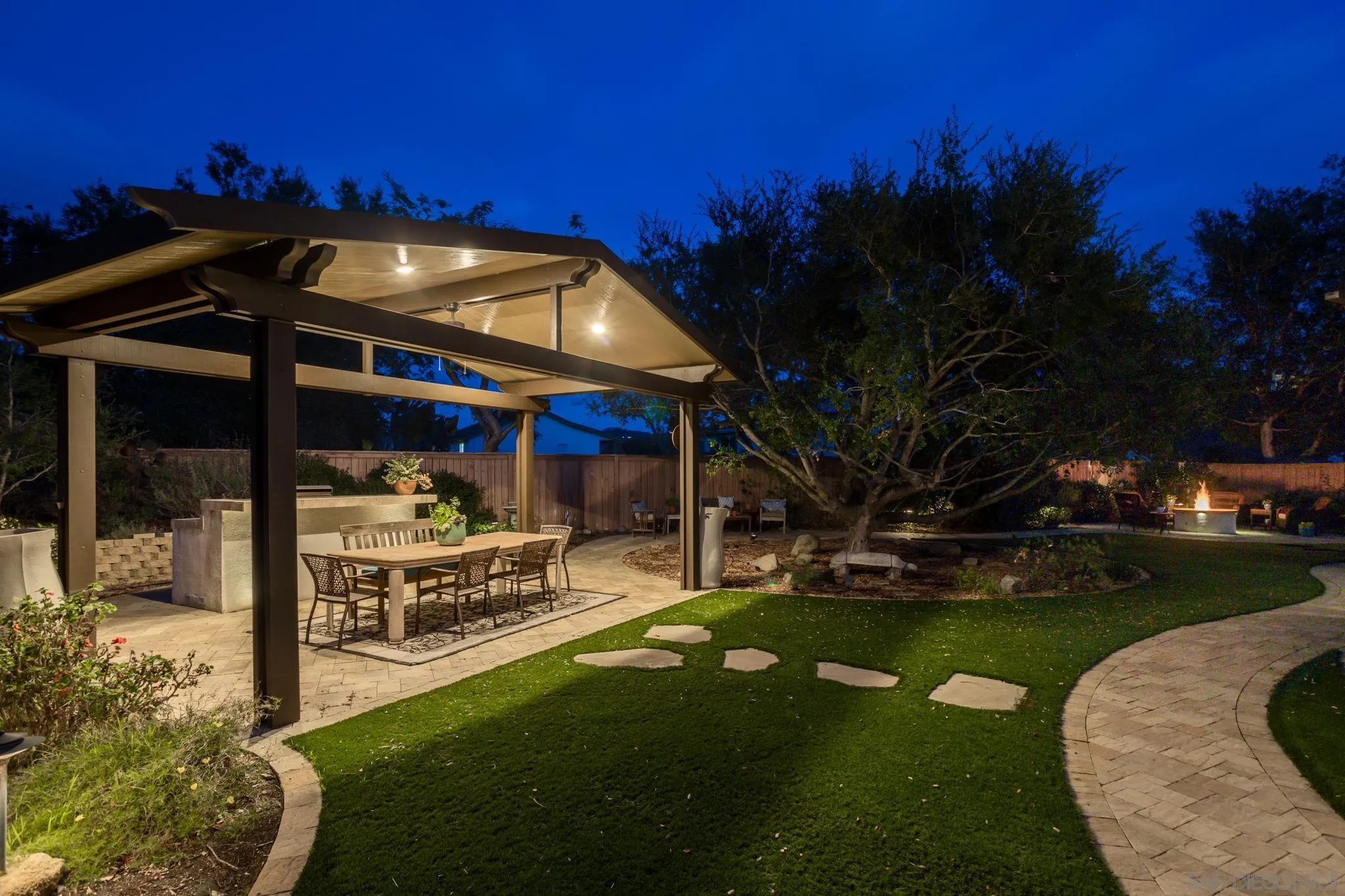 5462 Senegal Street Oceanside, CA 92057 - Photo 32 of 47 a view of a house with backyard sitting area and garden