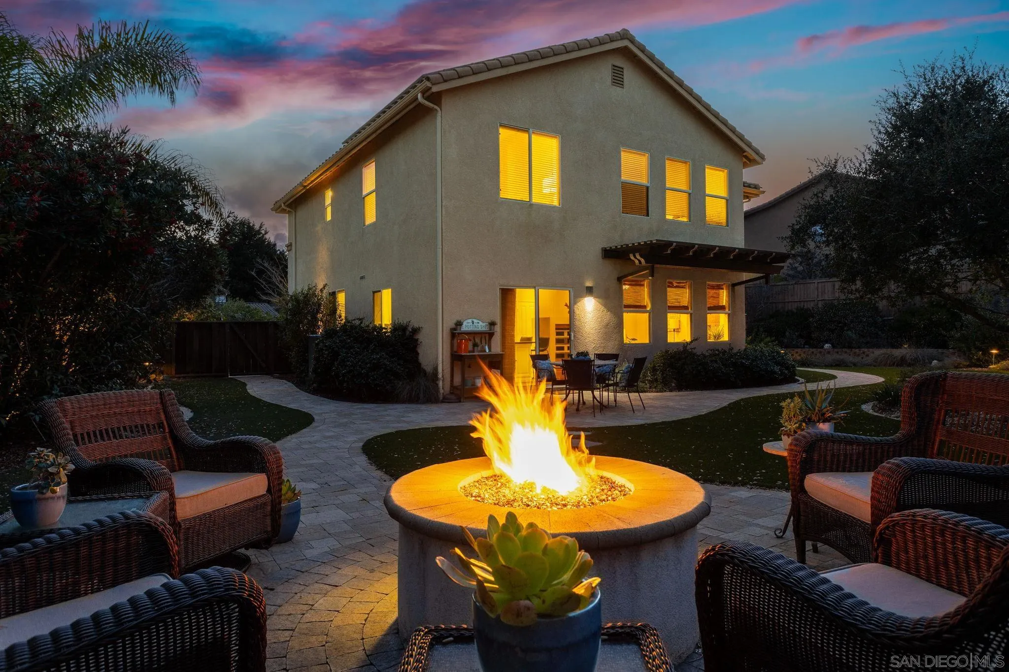 5462 Senegal Street Oceanside, CA 92057 - Photo 33 of 47 a view of a patio with couches table and chairs and potted plants
