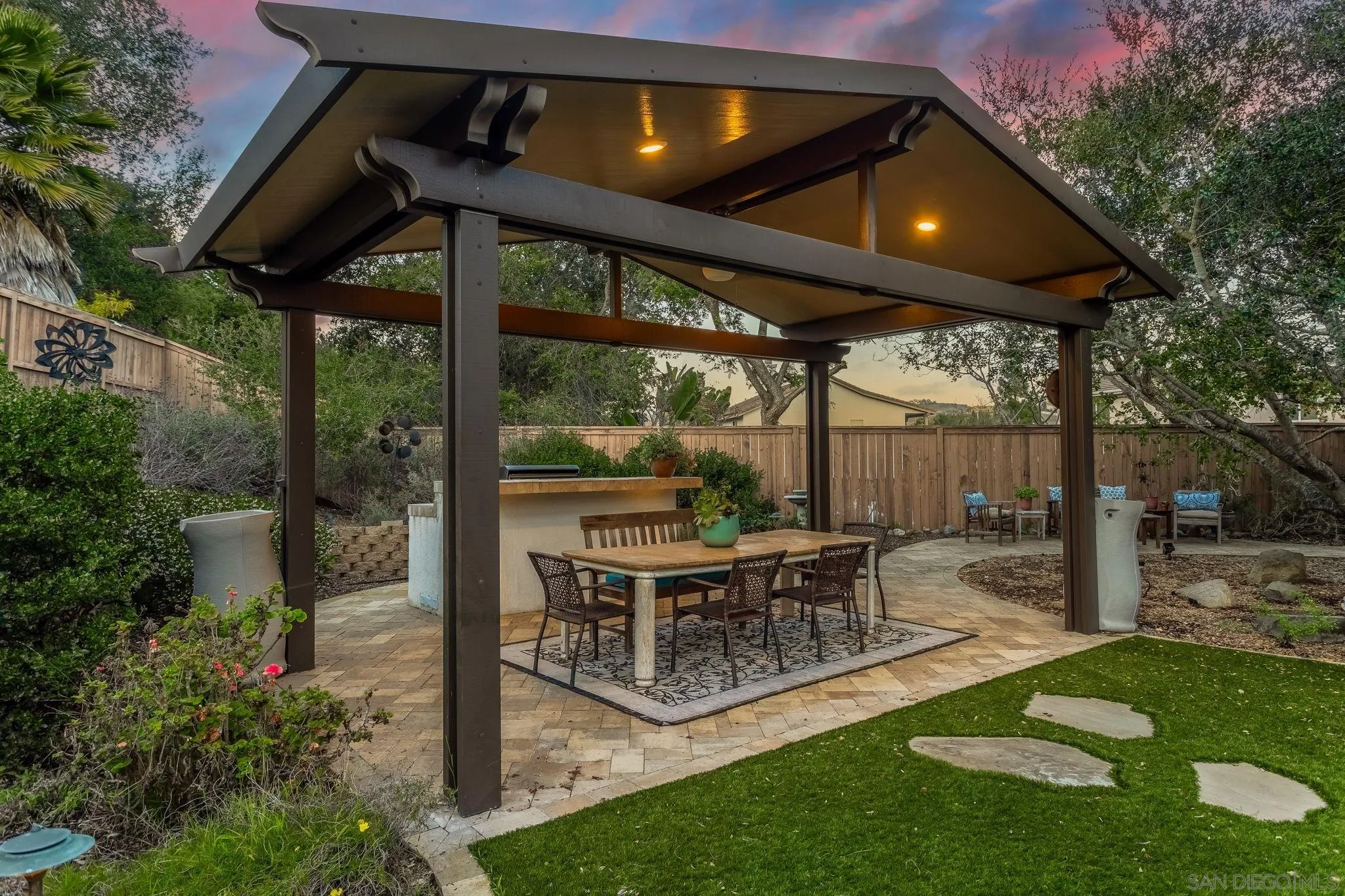 5462 Senegal Street Oceanside, CA 92057 - Photo 34 of 47 a view of an chair and table in backyard of the house