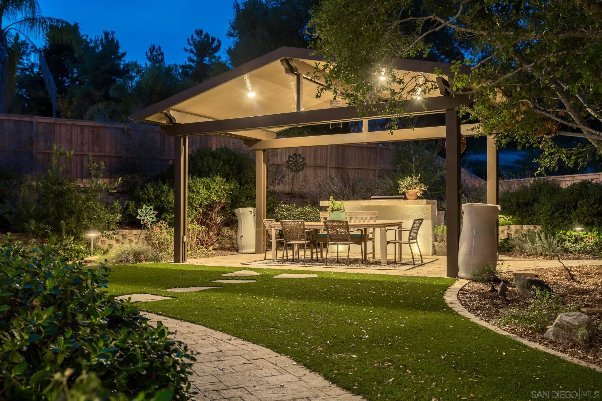 5462 Senegal Street Oceanside, CA 92057 - Photo 35 of 47 a front view of a house with a yard table and chairs