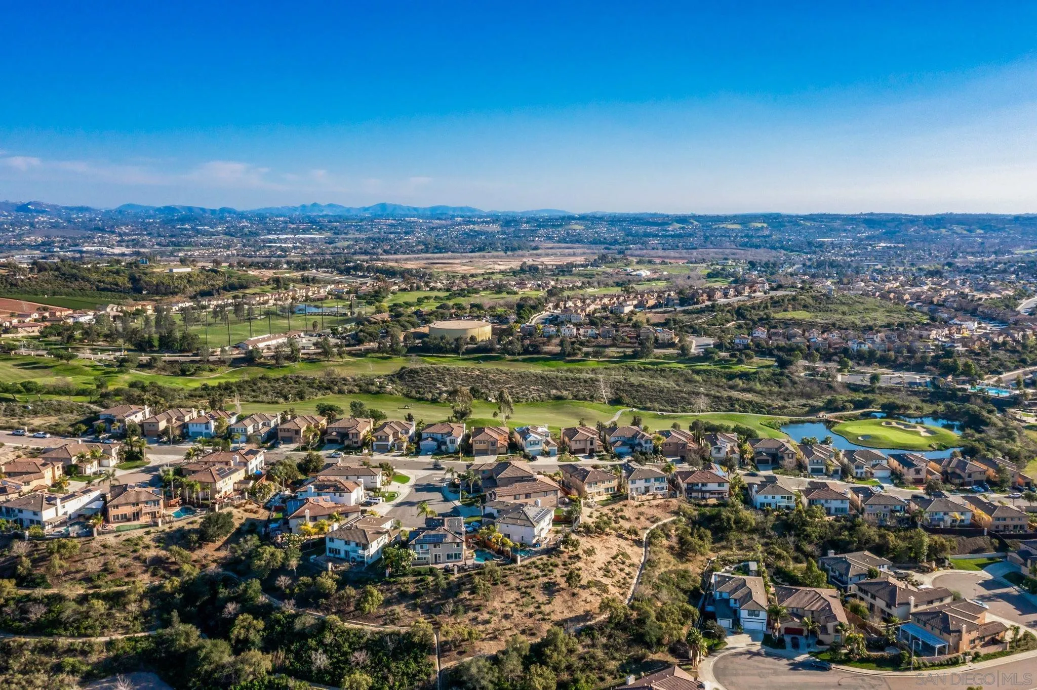 5462 Senegal Street Oceanside, CA 92057 - Photo 43 of 47 an aerial view of a city with lots of residential buildings