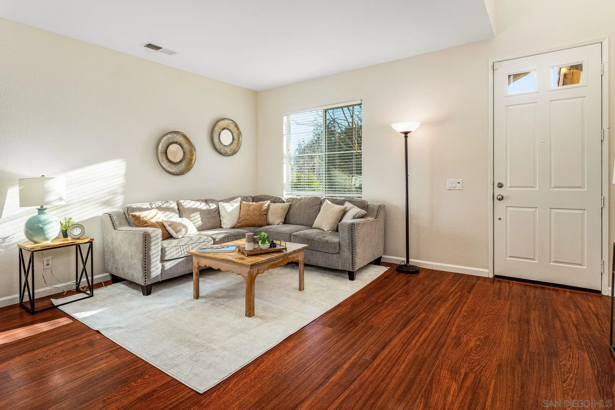 5462 Senegal Street Oceanside, CA 92057 - Photo 5 of 47 a living room with furniture and wooden floor