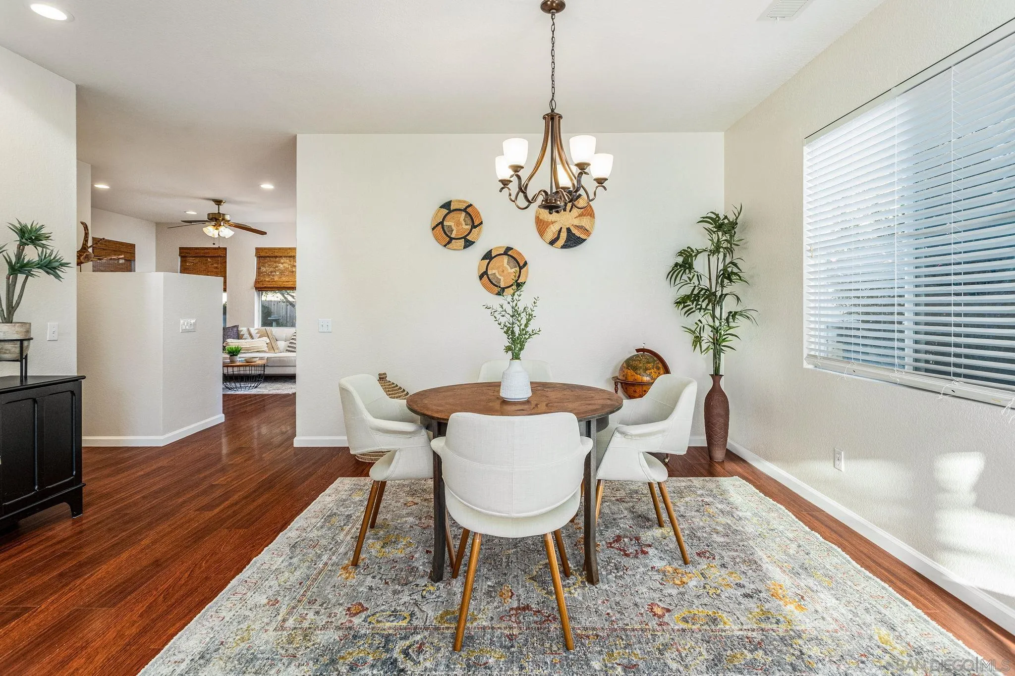 5462 Senegal Street Oceanside, CA 92057 - Photo 6 of 47 a view of a dining room with furniture wooden floor and chandelier