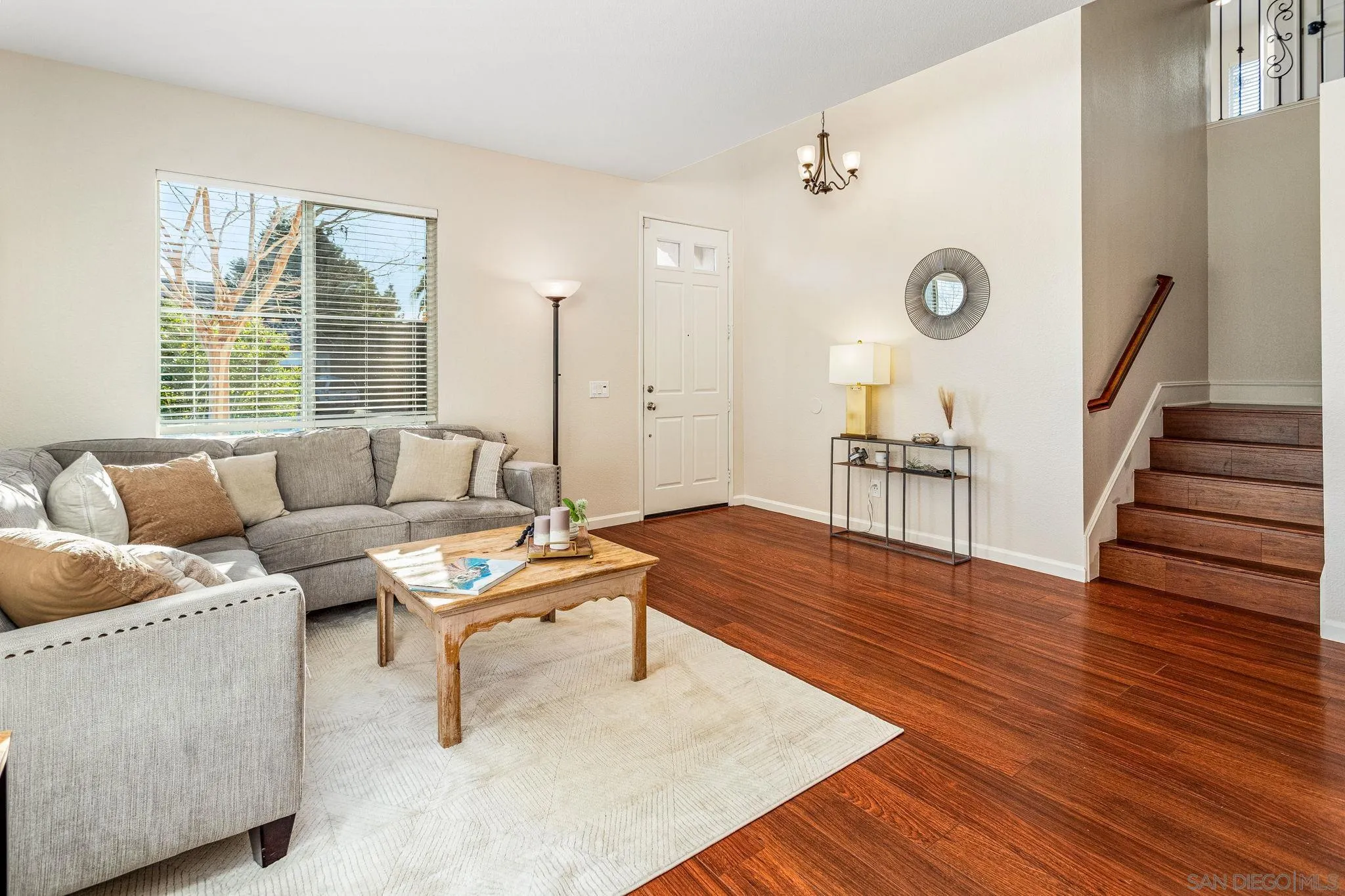 5462 Senegal Street Oceanside, CA 92057 - Photo 7 of 47 a living room with furniture and a wooden floor