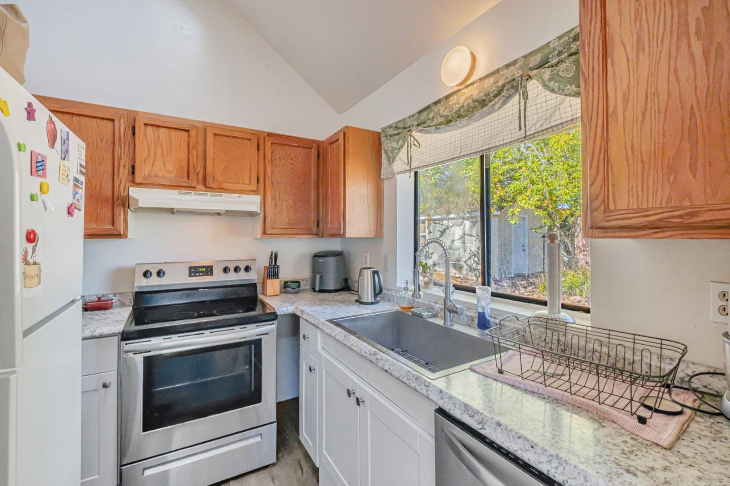222 Highview Drive Santa Cruz, CA 95060 - Photo 25 of 29 a kitchen with a stove a sink and a microwave