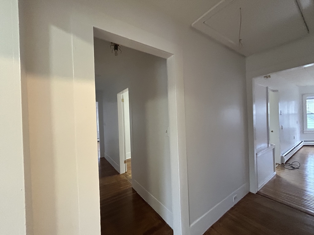 17 Lincoln Street, Unit 2 Greenfield, MA 01301 - Photo 16 of 26 a view of a hallway with a wooden floor