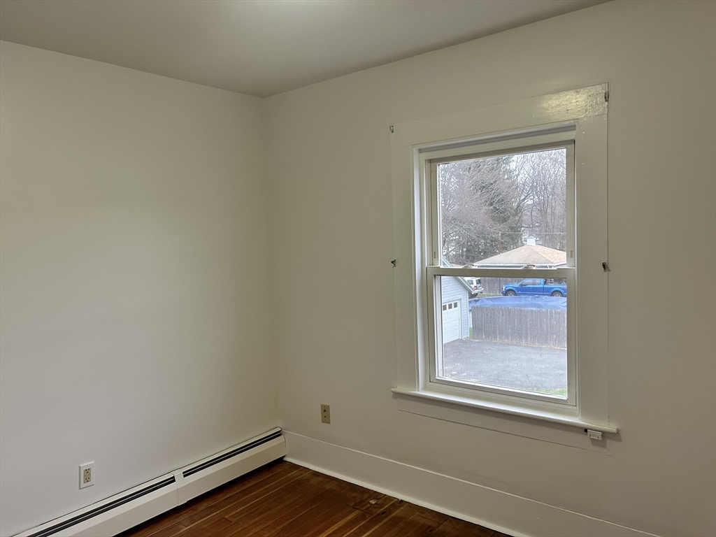 17 Lincoln Street, Unit 2 Greenfield, MA 01301 - Photo 18 of 26 a view of a small space with wooden floor and a window