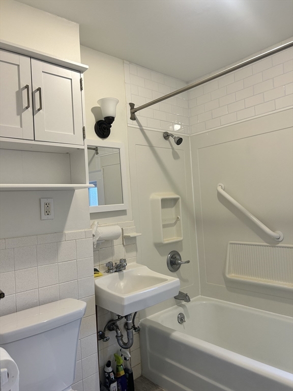 17 Lincoln Street, Unit 2 Greenfield, MA 01301 - Photo 19 of 26 a bathroom with a sink a toilet and shower