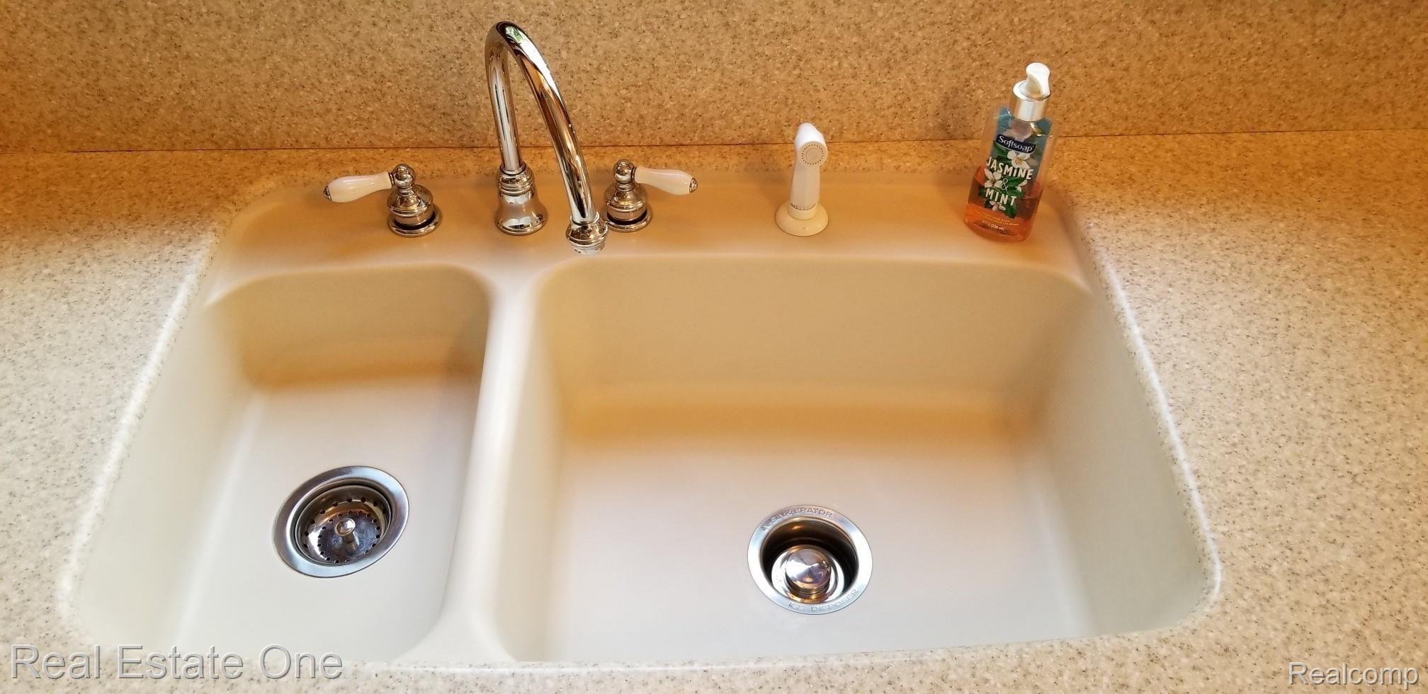 405 West Square Lake Road Troy, MI 48098 - Photo 10 of 24 corian sink.jpg