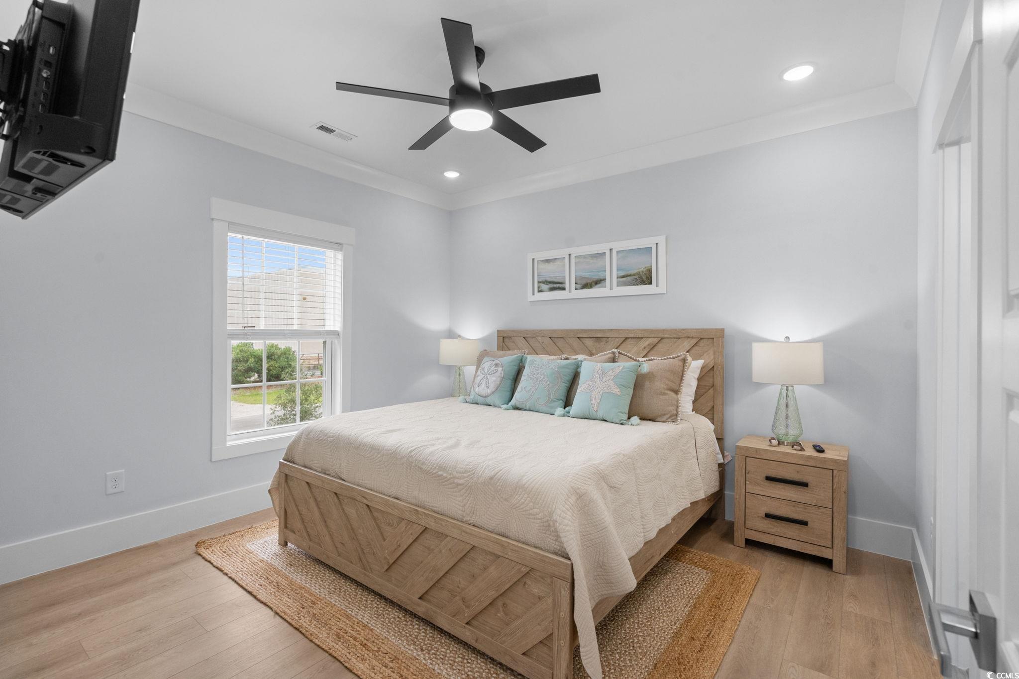 2312 Seaseeker Lane Myrtle Beach, SC 29577 - Photo 14 of 37 Bedroom featuring crown molding, light wood-type flooring, recessed lighting, and a ceiling fan