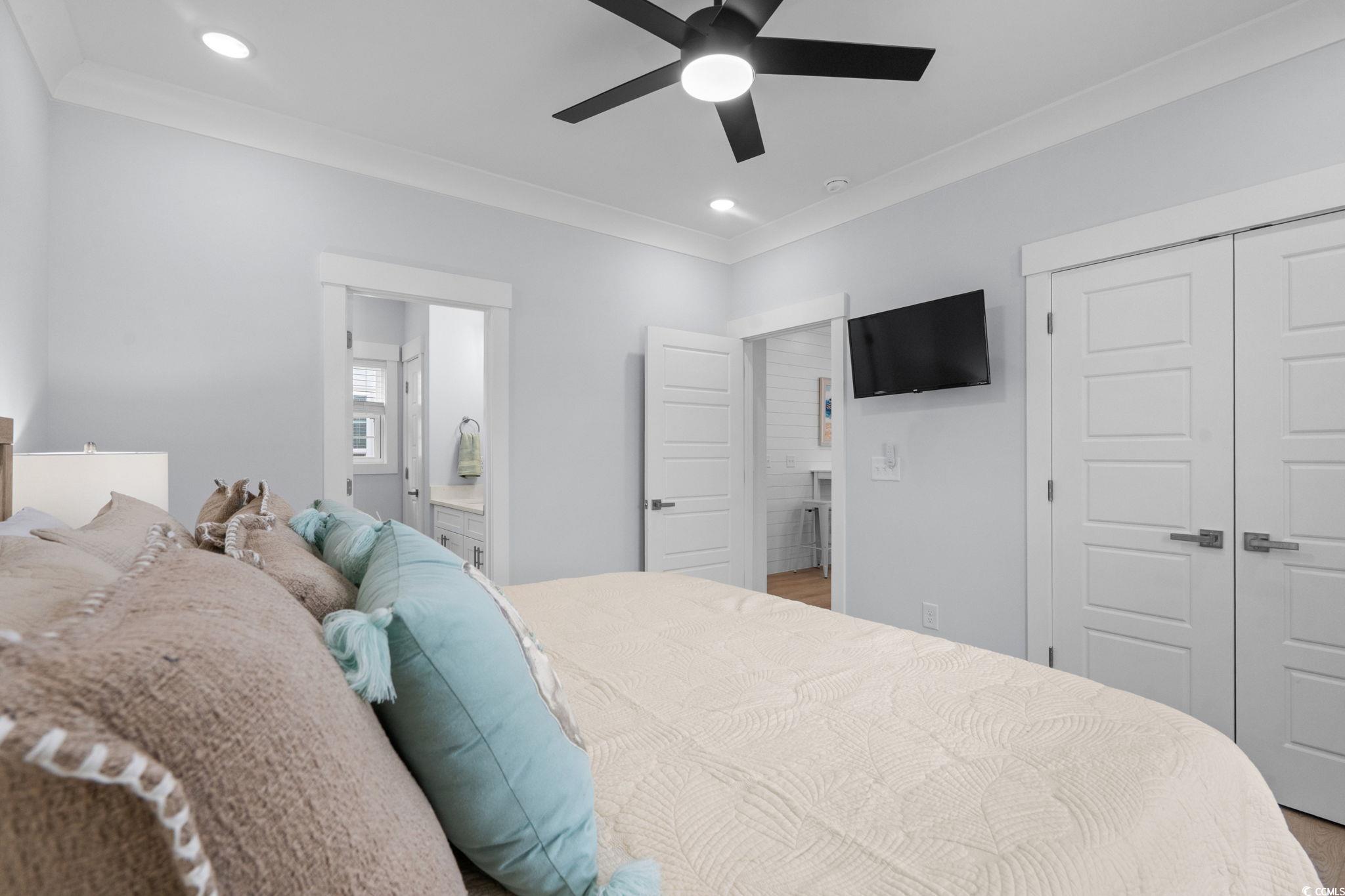 2312 Seaseeker Lane Myrtle Beach, SC 29577 - Photo 15 of 37 Bedroom featuring crown molding, recessed lighting, a closet, and a ceiling fan