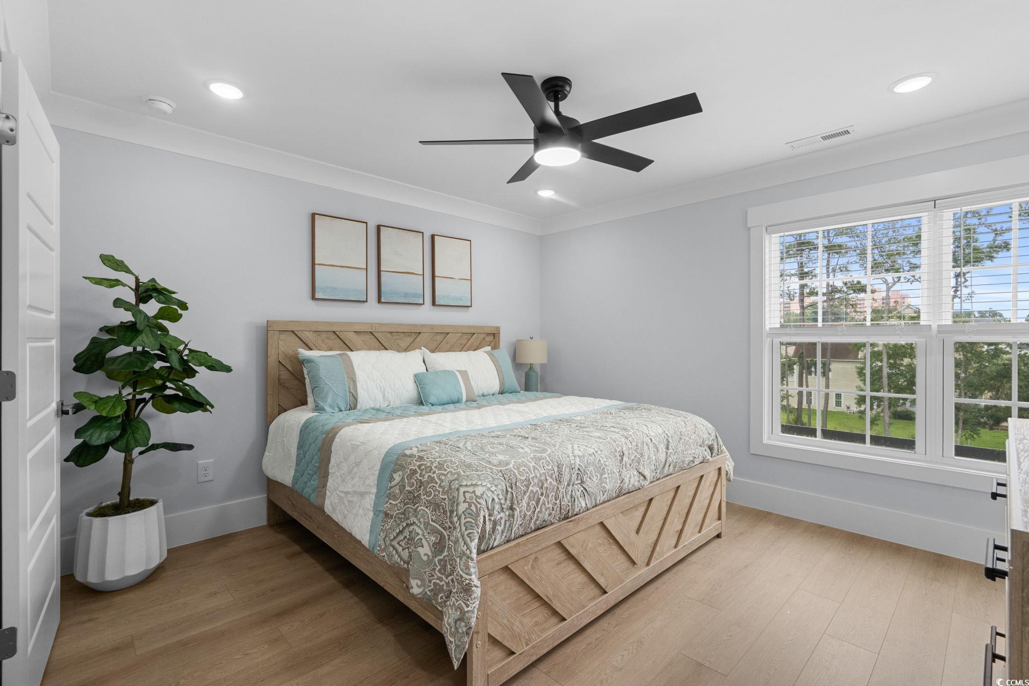 2312 Seaseeker Lane Myrtle Beach, SC 29577 - Photo 24 of 37 Bedroom with light wood-style floors, a ceiling fan, crown molding, and recessed lighting