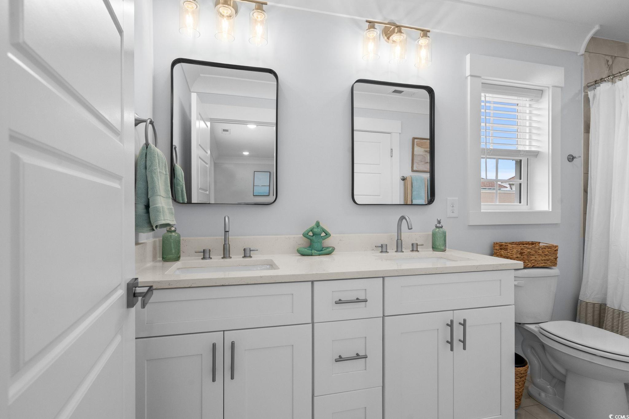 2312 Seaseeker Lane Myrtle Beach, SC 29577 - Photo 26 of 37 Full bathroom with double vanity and curtained shower