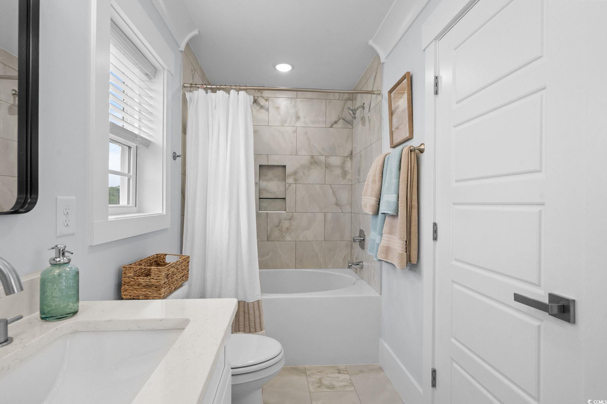2312 Seaseeker Lane Myrtle Beach, SC 29577 - Photo 27 of 37 Bathroom with vanity, shower / tub combo with curtain, and recessed lighting
