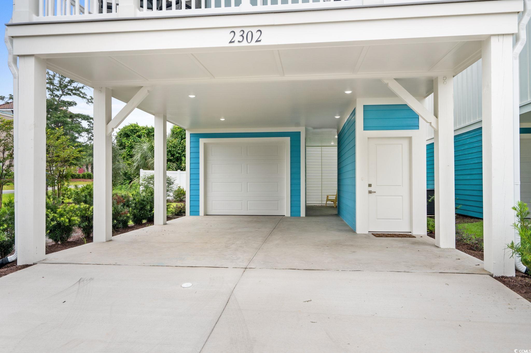 2312 Seaseeker Lane Myrtle Beach, SC 29577 - Photo 4 of 37 Garage with driveway