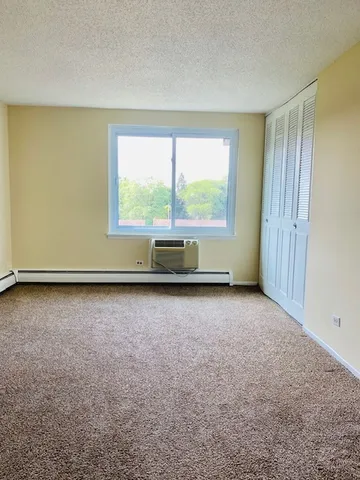 an empty room with large windows