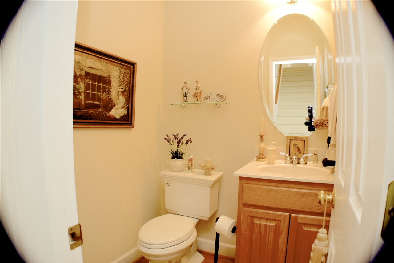 620 Middle Bridge Road Wake Forest, NC 27587 - Photo 17 of 25 Wide angle lens distorts picture shape but the 1/2 bath/power room has a pedestal sink and new water saver toilet that is chair height. Powder Room