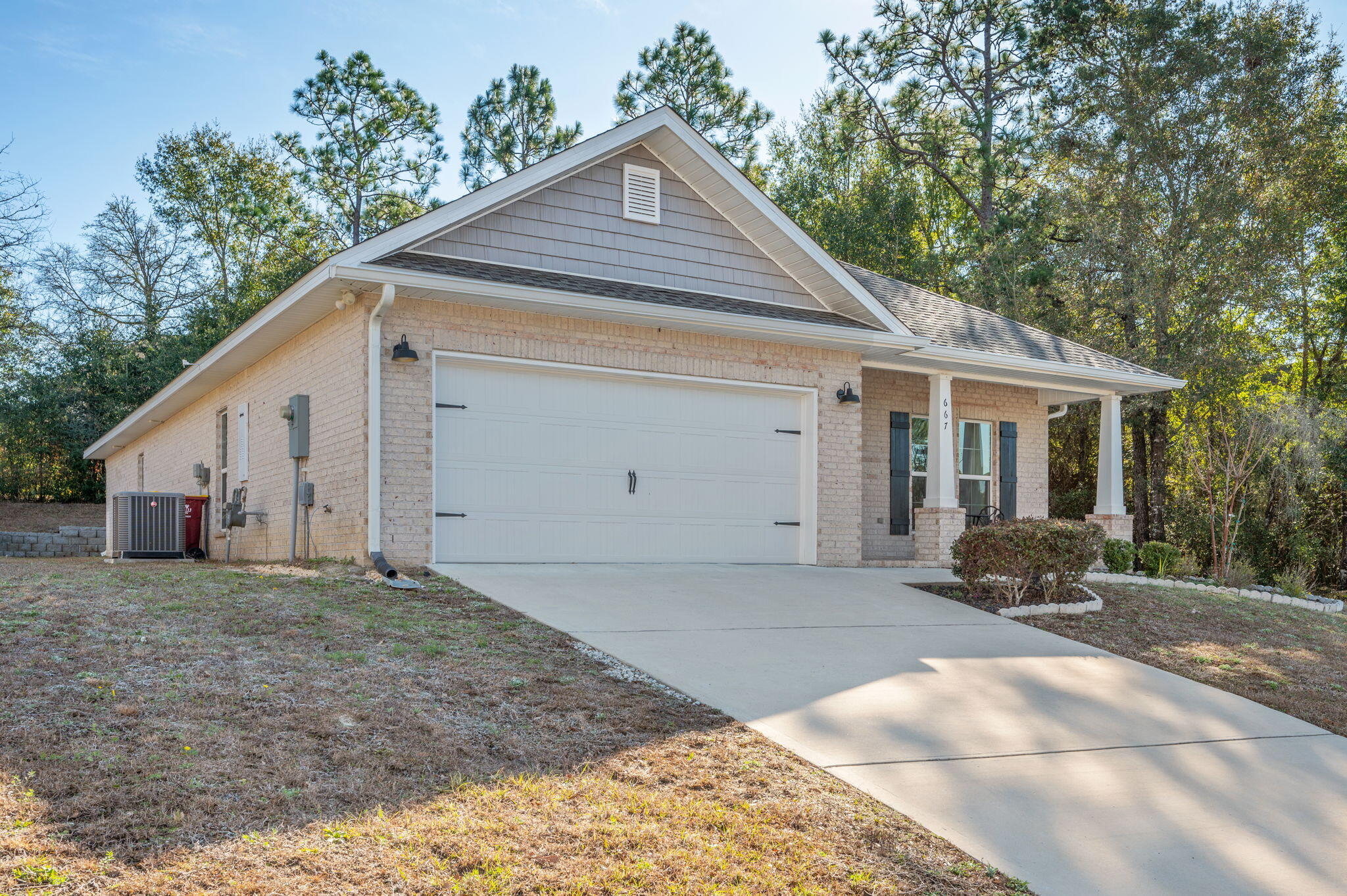 667 Red Fern Road Crestview, FL 32536 - Photo 3 of 42 a view of a house with a yard and large tree