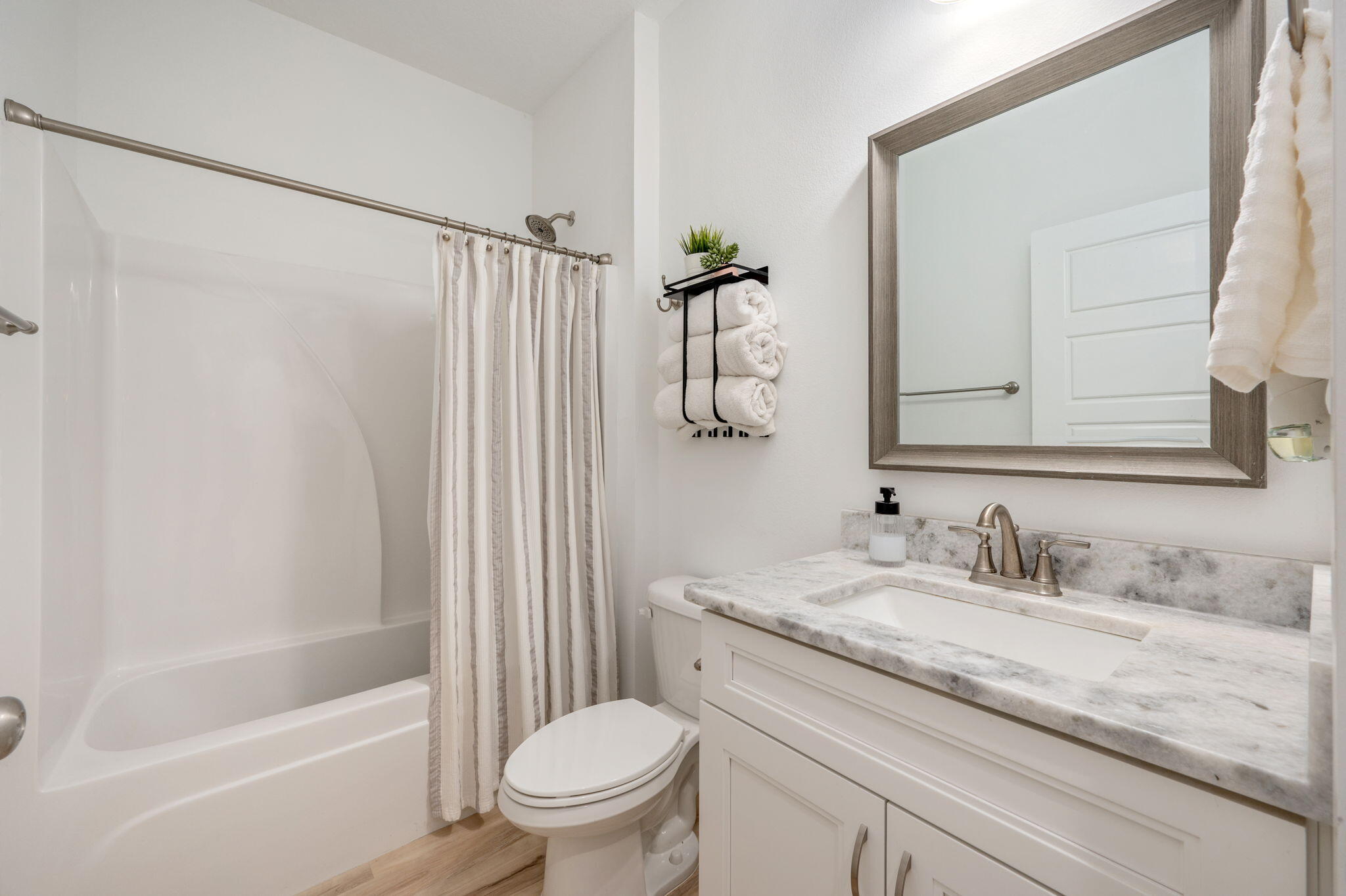 667 Red Fern Road Crestview, FL 32536 - Photo 31 of 42 a bathroom with a granite countertop sink toilet and shower