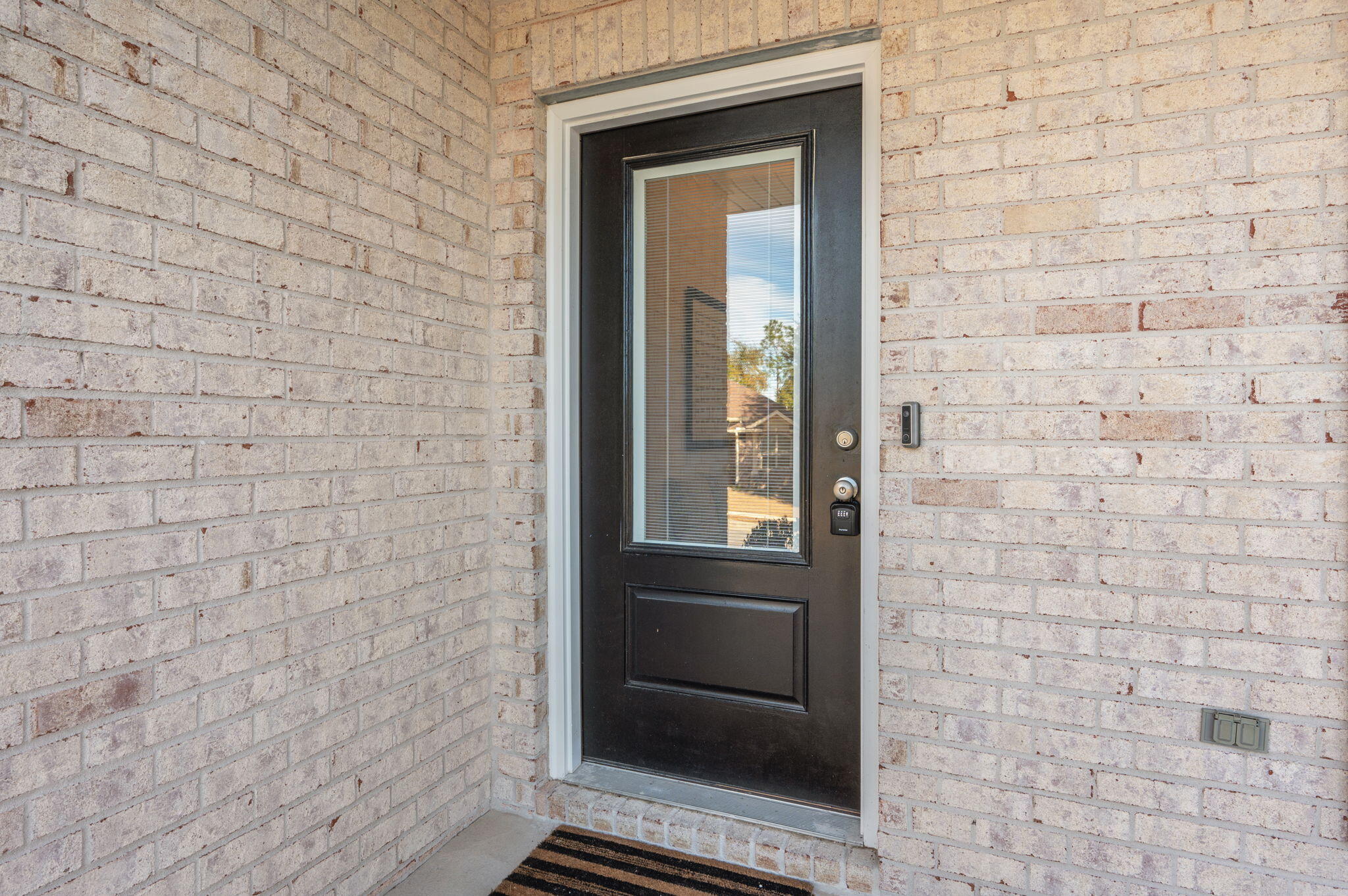 667 Red Fern Road Crestview, FL 32536 - Photo 4 of 42 a brick house with a door