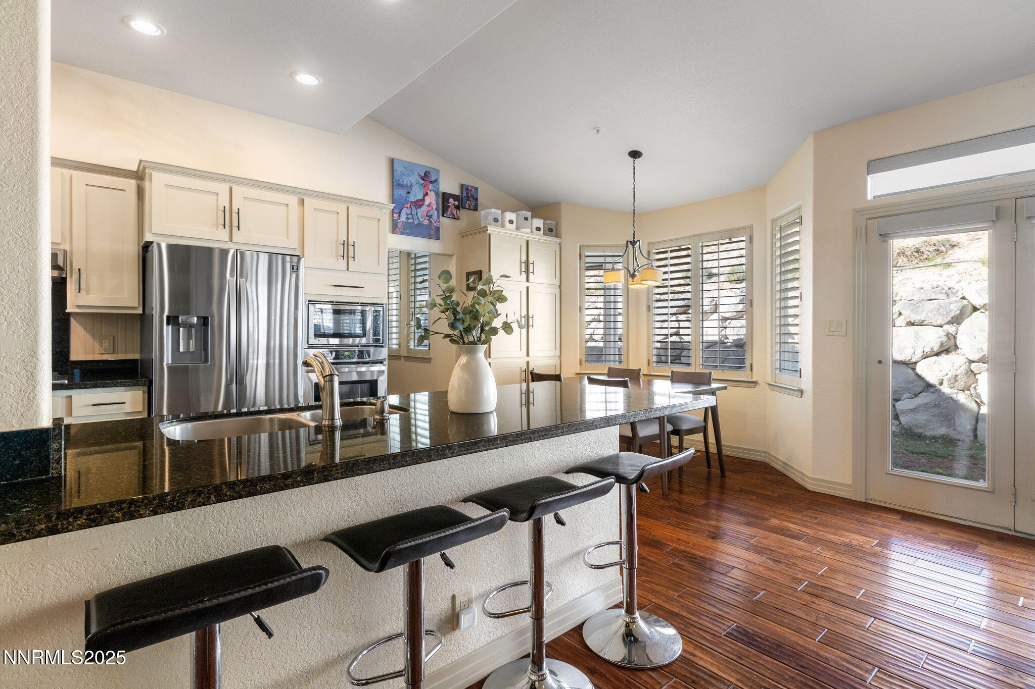2255 Hogan Court Reno, NV 89523 - Photo 11 of 30 a large kitchen with kitchen island granite countertop a large window and stainless steel appliances