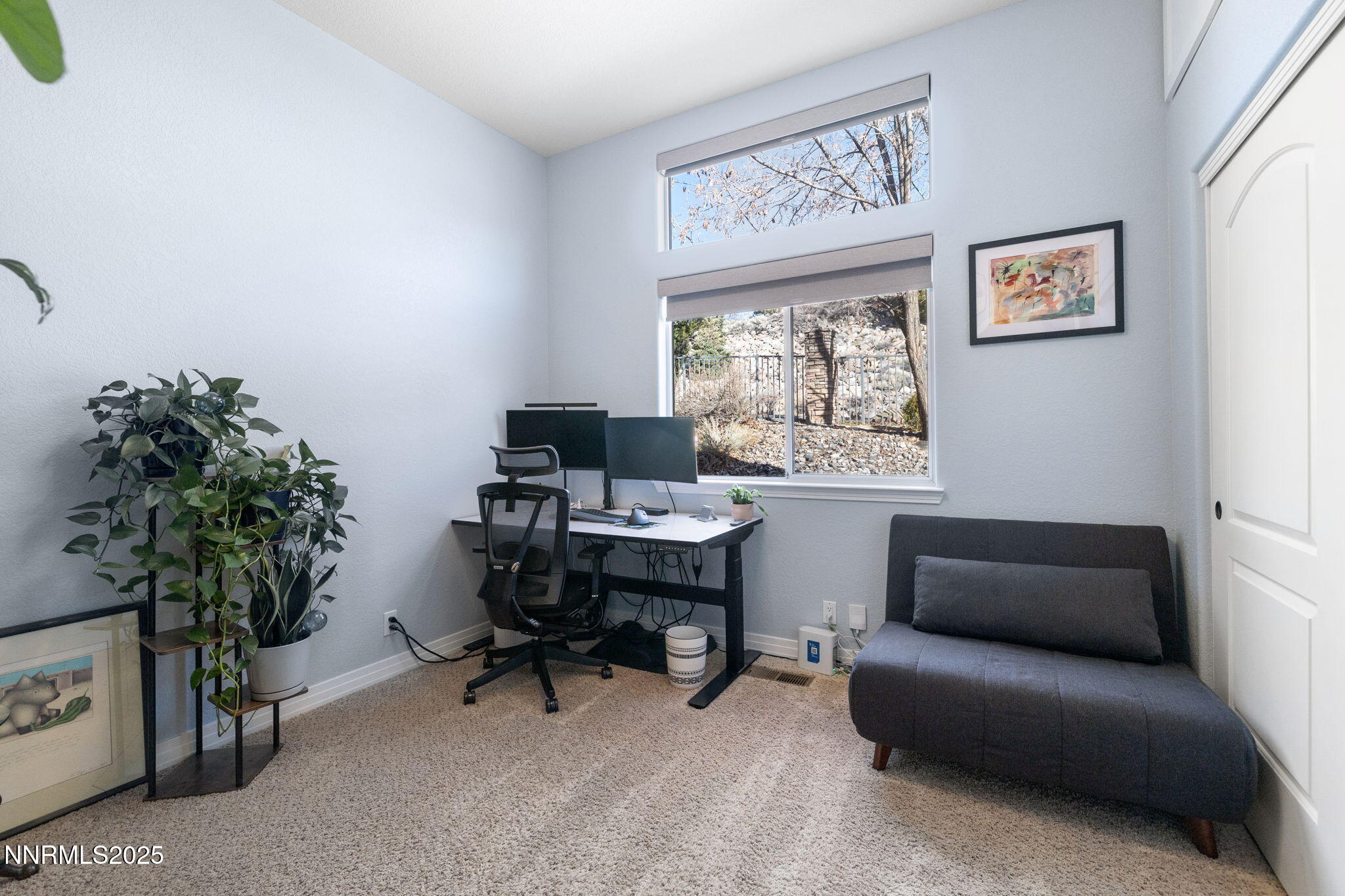 2255 Hogan Court Reno, NV 89523 - Photo 21 of 30 a livingroom with a couch and a potted plant